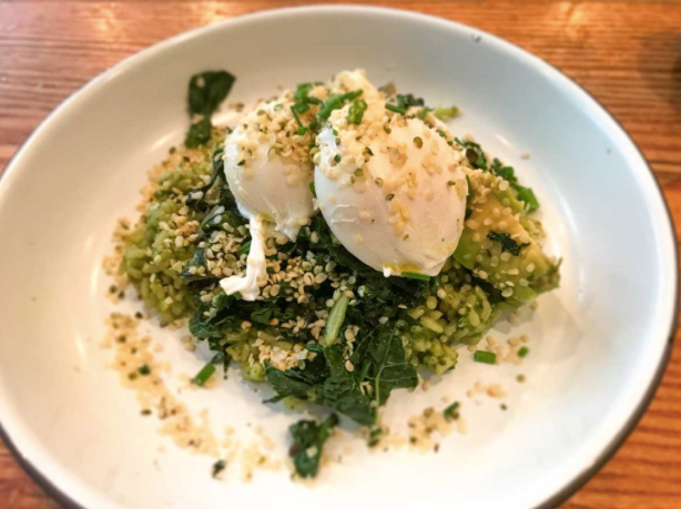 Picture of poached eggs with hemp seeds on greens on a plate