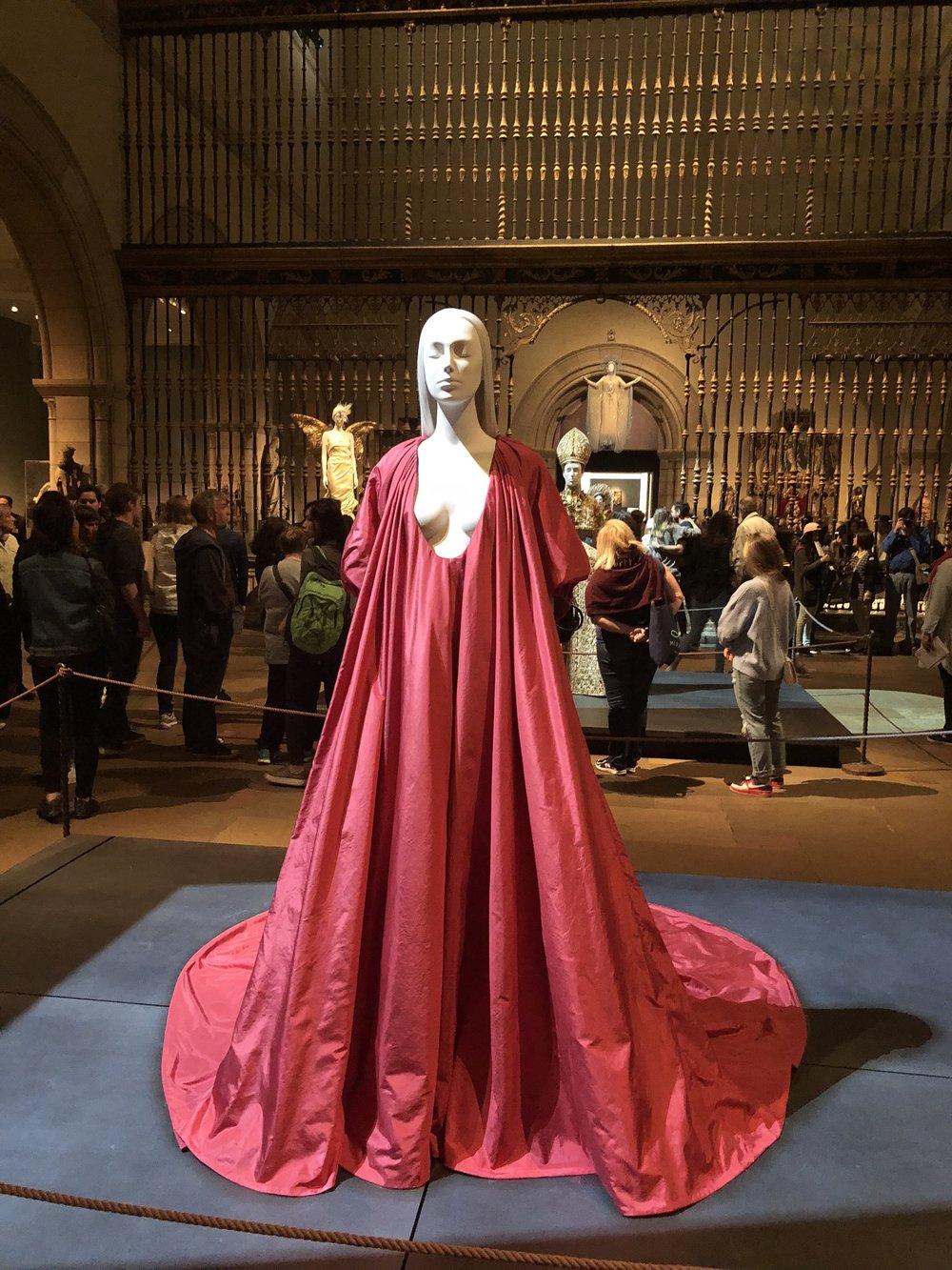 Mannequin wearing a red maxi dress in The Metropolitan Museum of Art