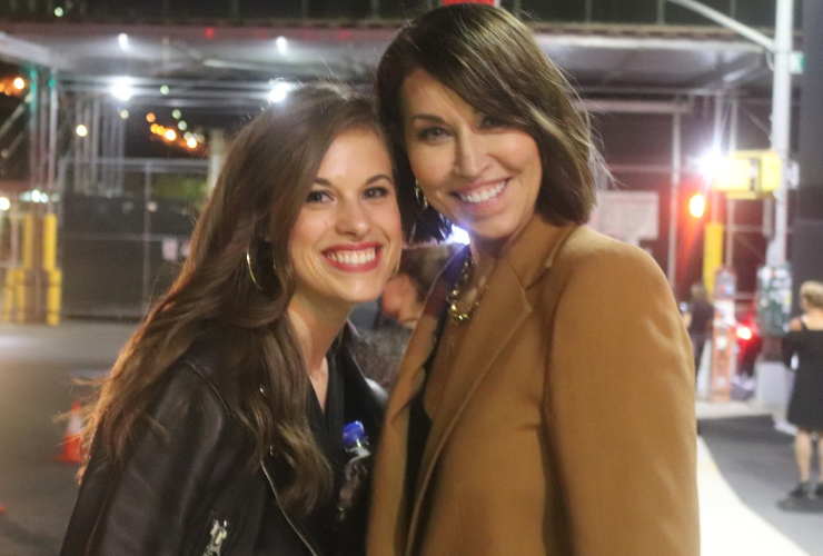 two white women with brown hair smiling at the camera