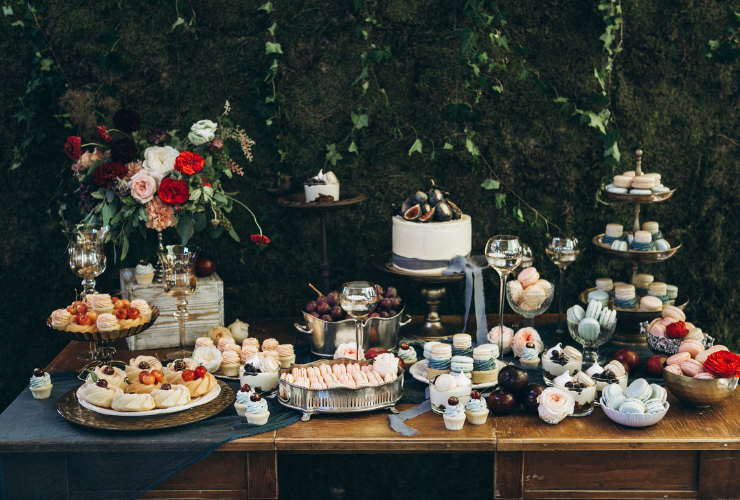 Table filled with wedding cake & desserts